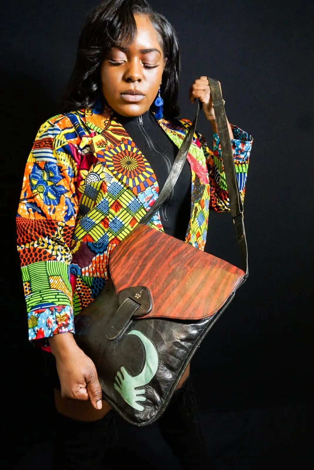 Crossbody Leather Bag with adjustable strap and lined with Ankara 19"x15.5".