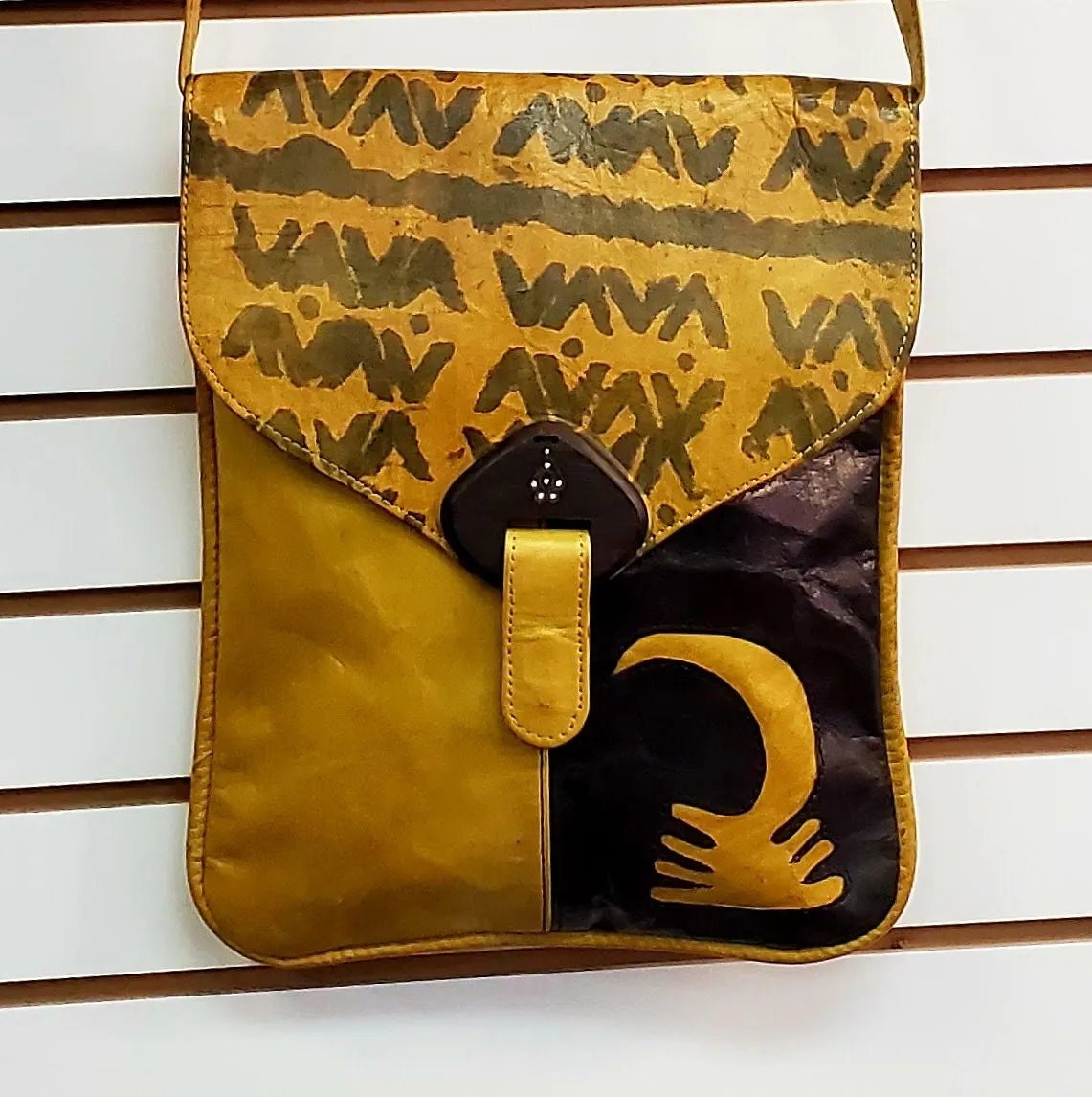 Crossbody Leather Bag with adjustable strap and lined with Ankara 19"x15.5".