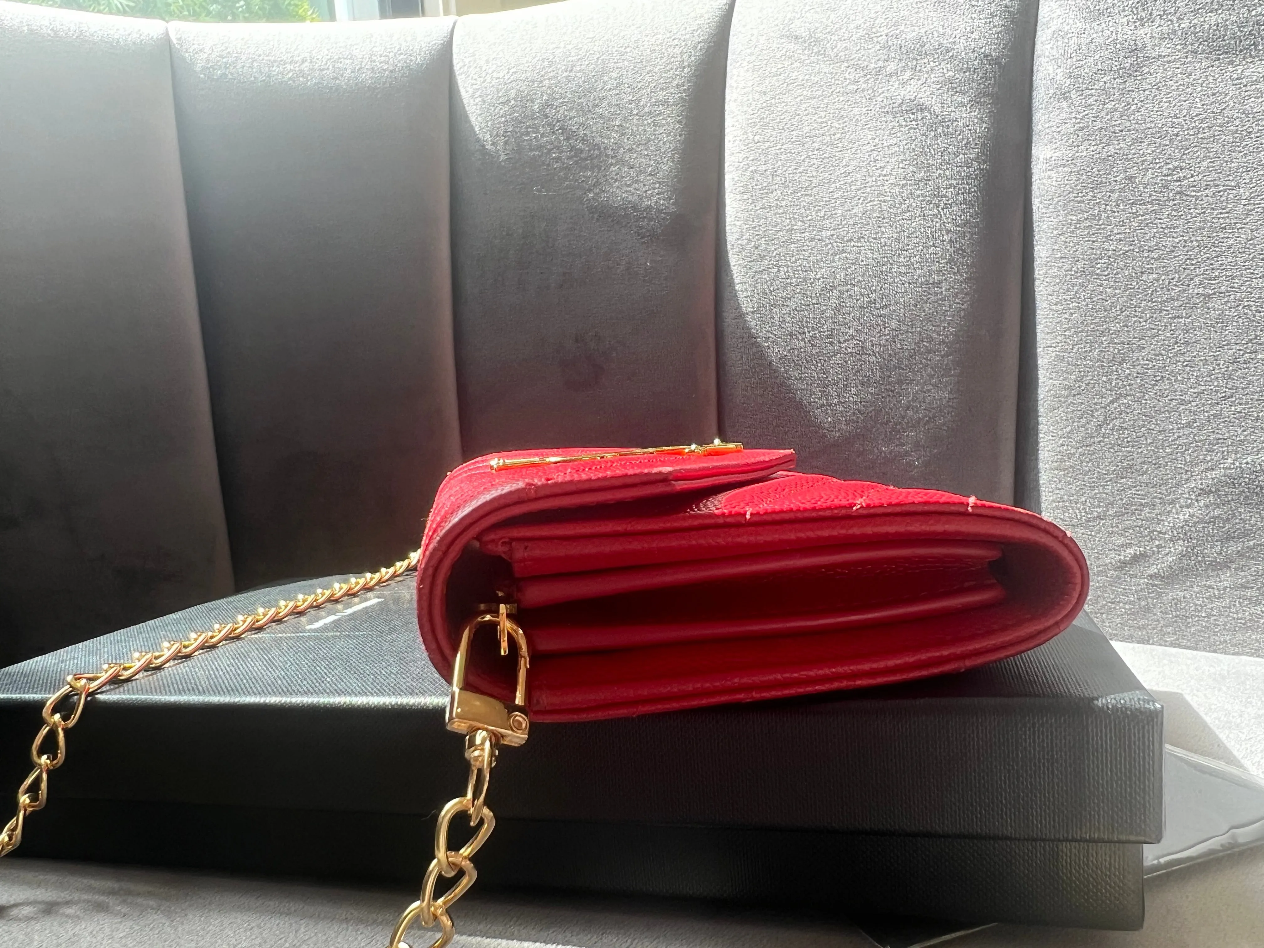 Yves Saint Laurent Cassandre envelope wallet on chain red